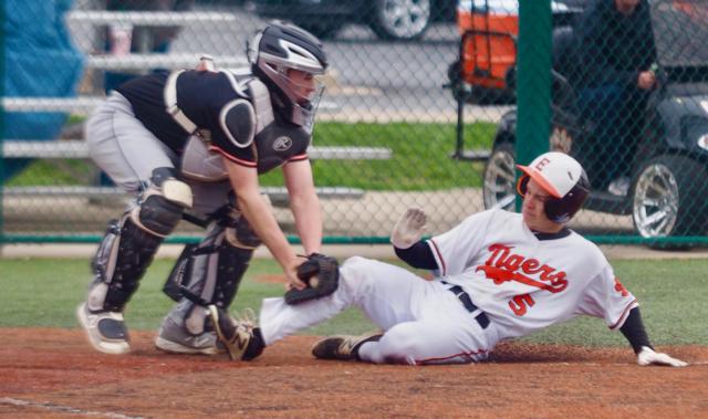 Blake Burris gets tagged out at home plate.