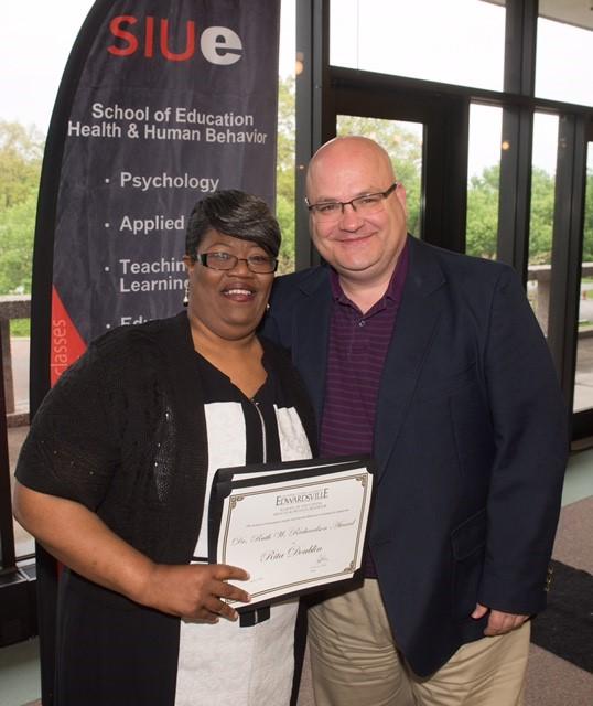 East St. Louis native Rita Doublin earned the Miriam C. Dusenbery Outstanding Student Award and the Dr. Ruth W. Richardson Award. She stands next to SIUE&rsquo;s Dr. Stephen Marlette, associate professor in the Dept. of Teaching and Learning.