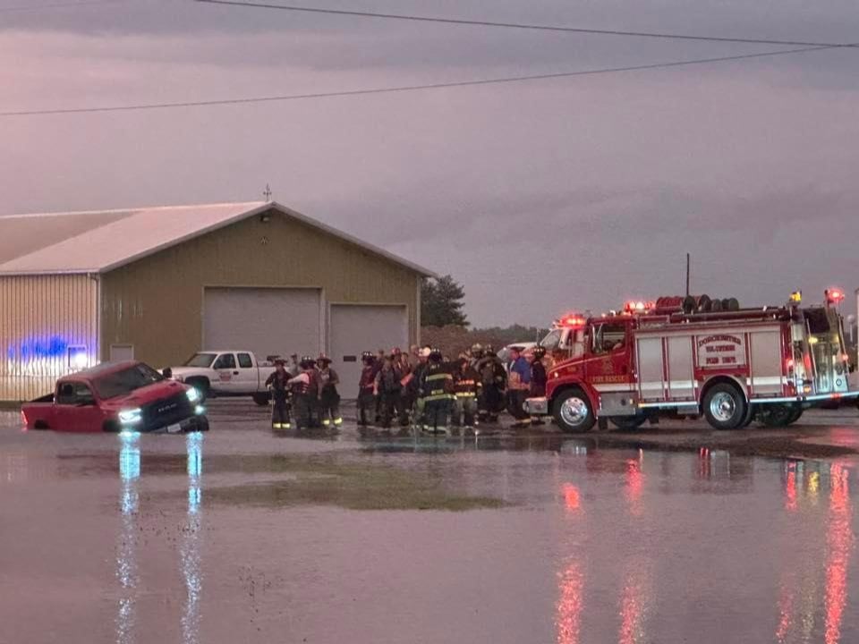Michael Smith Jr. shows the scene in WIlsonville on Monday with a truck off in the high water.