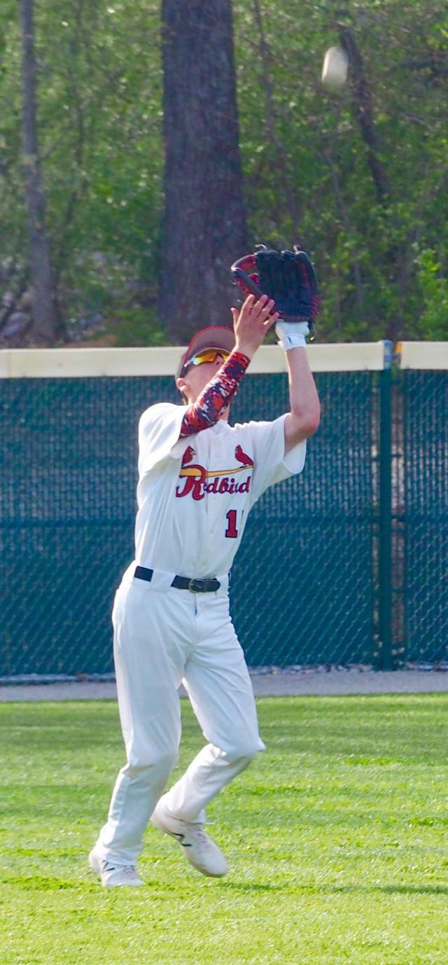 Ben Mossman catches a fly ball in left field.