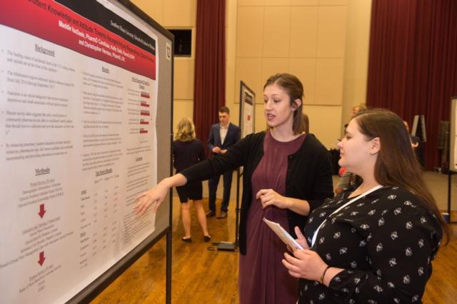SIUE School of Pharmacy’s Maddie VanDaele presents her research at an SIUE event.
