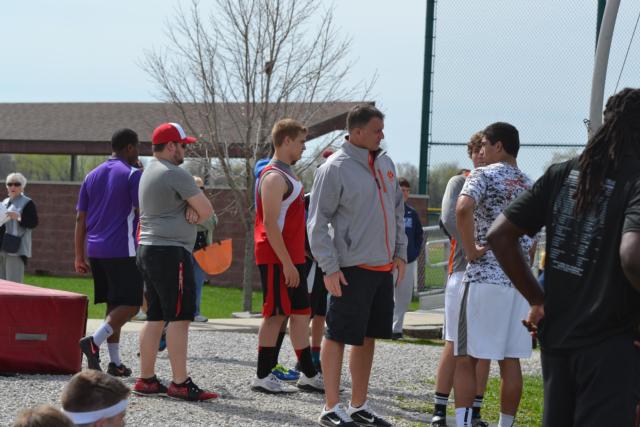 Edwardsville High School head football coach and weights group coach on the track and field team Matt Martin provides advice to A.J. Epenesa in the discus. Martin has had a significant influence on sophomore Epenesa's life so far and done the same for many other EHS athletes before him with his coaching style. (Photo by Dan Brannan)