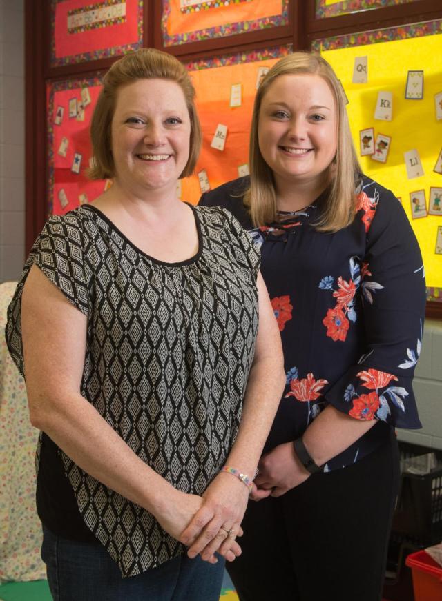 SIUE elementary education graduate Katie Shannon (right) and her cooperating teacher Ina Bowling smile in Bowling’s classroom at Webster Elementary School in Collinsville.