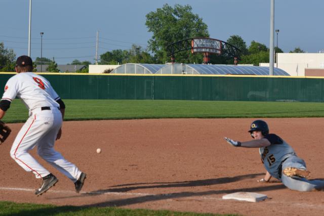 O'Fallon slides in for a close play at third against Edwardsville on Tuesday afternoon. (Photo by Dan Brannan)