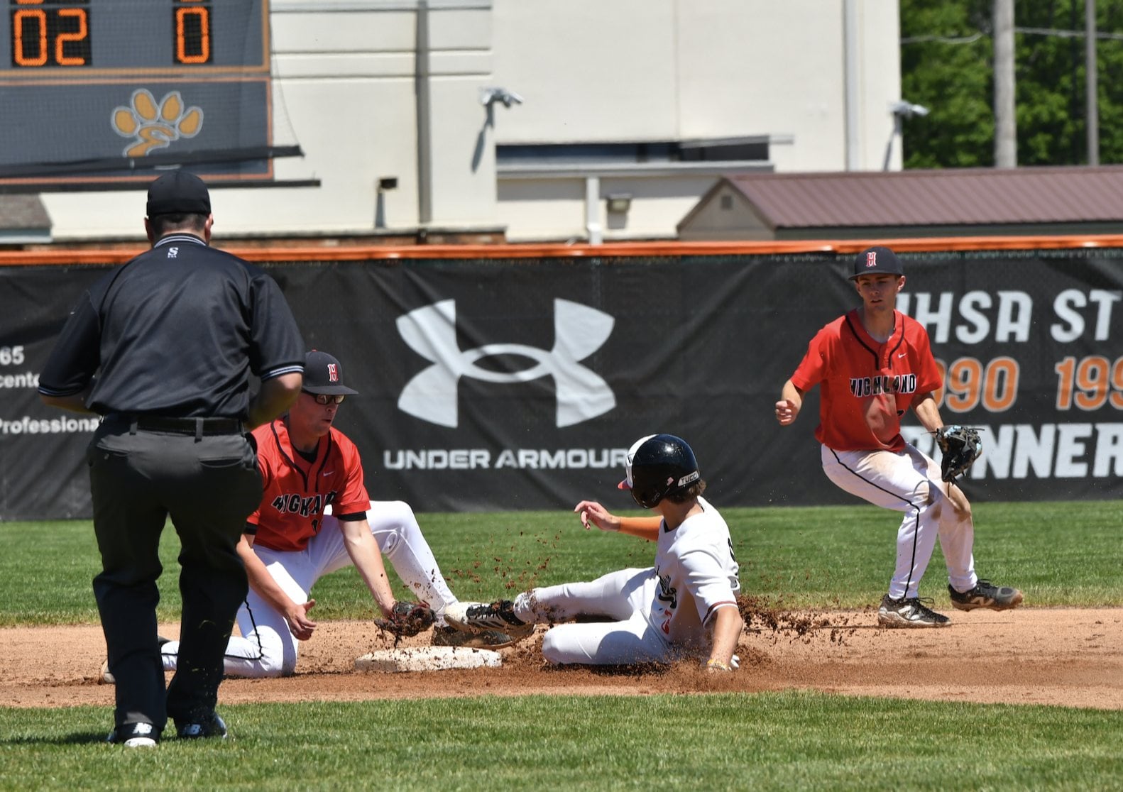 A close play at second base on Saturday at Edwardsville in the game between the Tigers and Highland. (Photos by Dan Brannan)