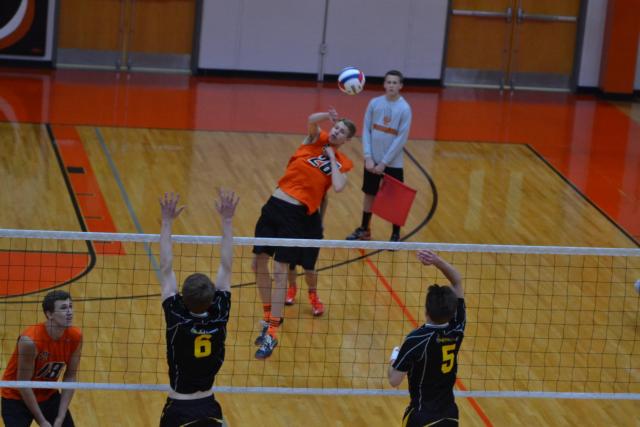 Will Frank knocks the ball back at his opponent on Monday night at Edwardsville. (Photo by Dan Brannan)