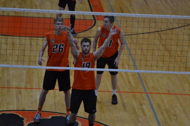 Edwardsville's Trey Hagen pounds a spike at Vianney on Monday night. (Photo by Dan Brannan)
