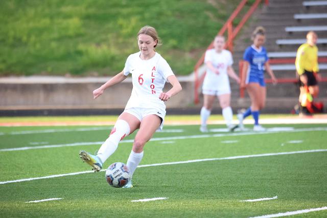 Sophomore midfielder Lyndsey Miller makes a pass to a teammate in a game played earlier this season at Public School Stadium against Marquette Catholic. Thursday evening against Belleville East, her two goals helped go on to a 3-0 win in Alton's final regular season game. 