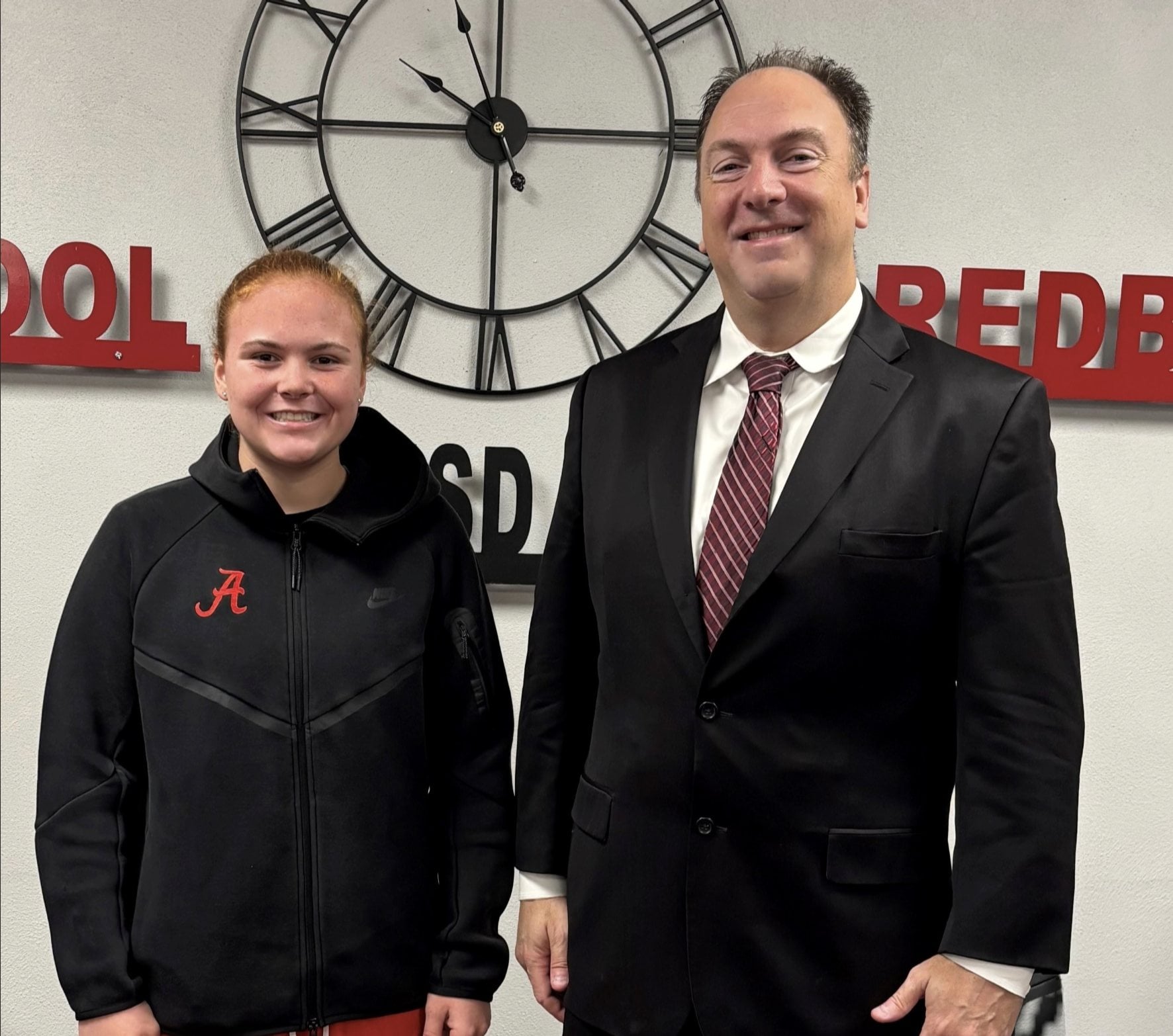 Sophomore Claire Delehanty and Edward Jones' Art Fahrner shown for the Remarkable Redbird honor.