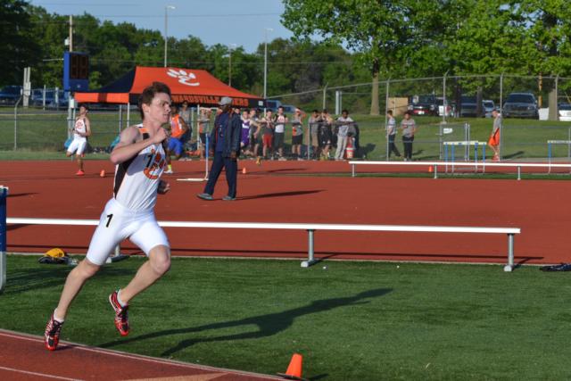 Edwardsville's Wes Schoenthal dashes to first place in the 800-meter run at the conference meet on Wednesday. (Photo by Dan Brannan)