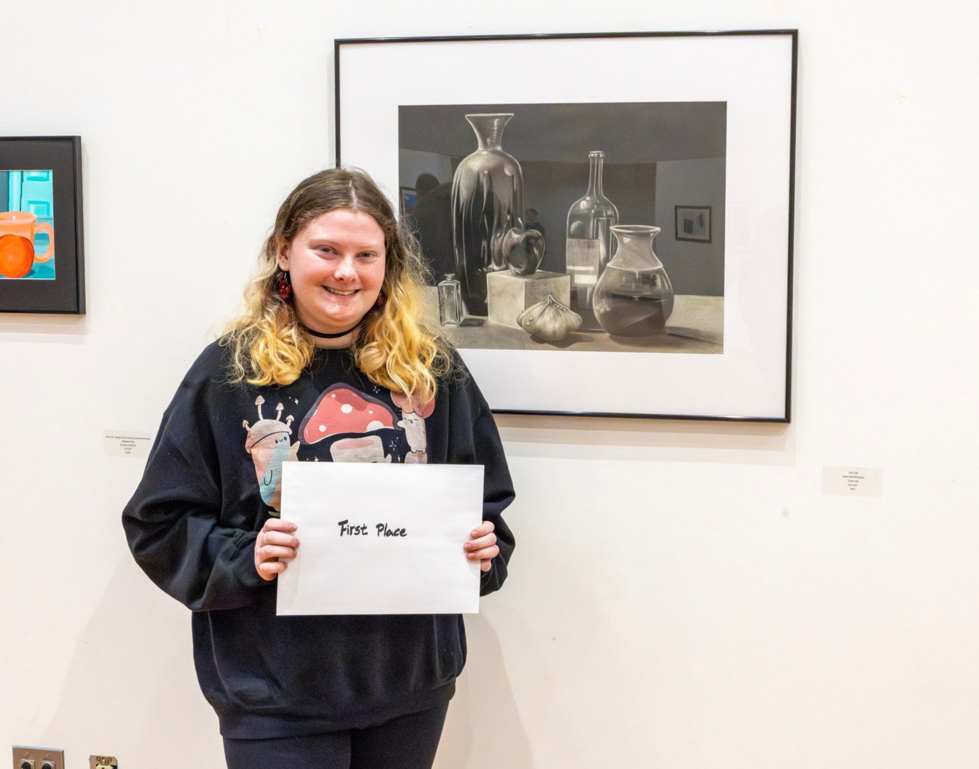Gabrielle McQuay won first place with her charcoal drawing entitled &ldquo;Still Life.&rdquo;