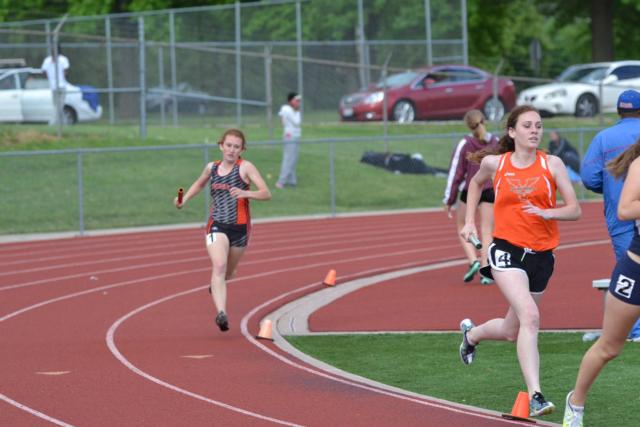 Victoria Vegher runs a leg on the 4 x 800 relay for Edwardsville. (Photo by Dan Brannan)