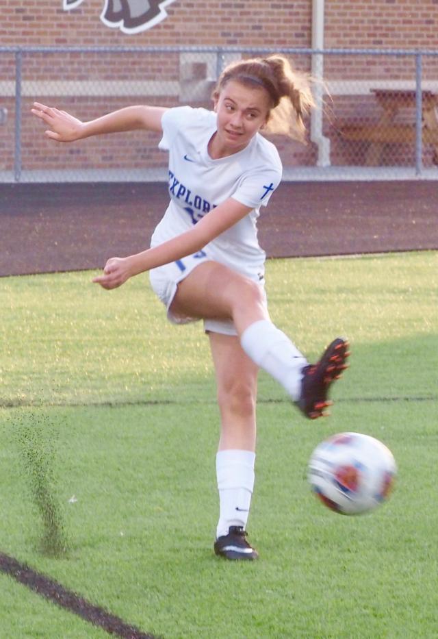 Ellie Jacobs (13) attempts a back pass.