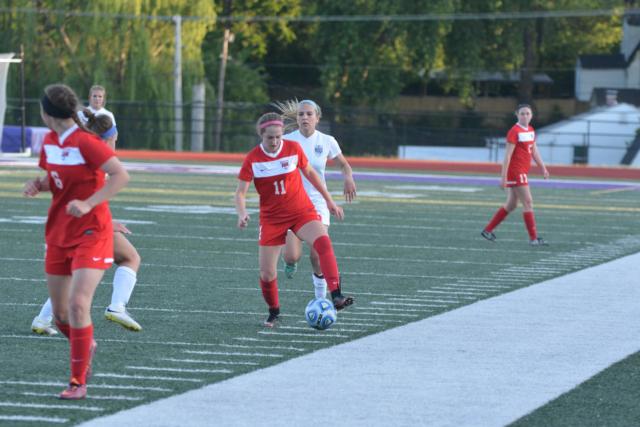 Bri Hatfield goes after the ball for Alton against Belleville East in Wednesday's sectional at Collinsville. (Photo by Dan Brannan)