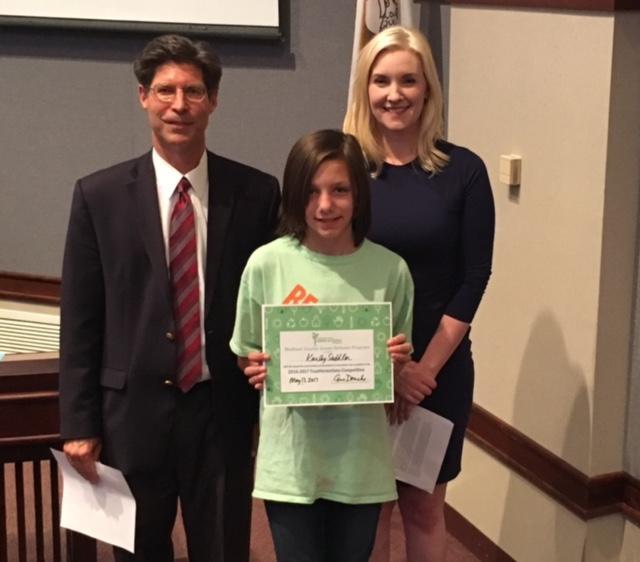Prenzler, Drueke present Karley Saddler of Columbus Elementary School in Edwardsville with a certificate of recognition for the Trashformation competition.