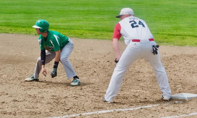 Ethan Brannan leads off at first base with Conner Gilman holding him on.