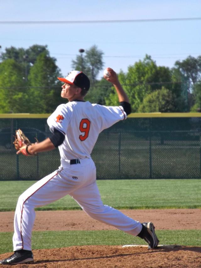 Edwardsville pitcher Jake Garella tosses a strike toward home plate against Collinsville on Tuesday afternoon. (Photo by Brent Feeney)