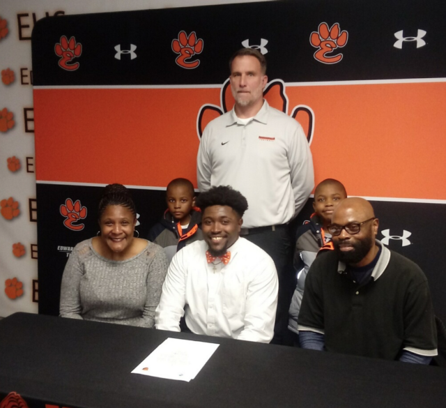 Trey Boyd signs his letter of intent with mom, Deborah, and dad, Monroe, in front, and in back, Makai, brother, Tigers' head football coach Matt Martin and Michael, a brother.