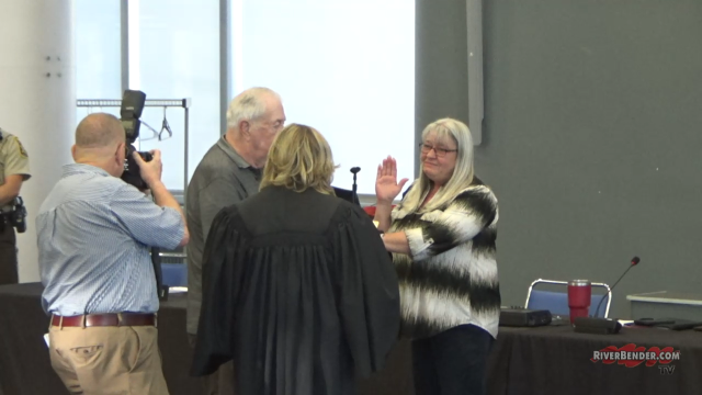 New Village Clerk Jacki Clayton (right) is sworn into office.