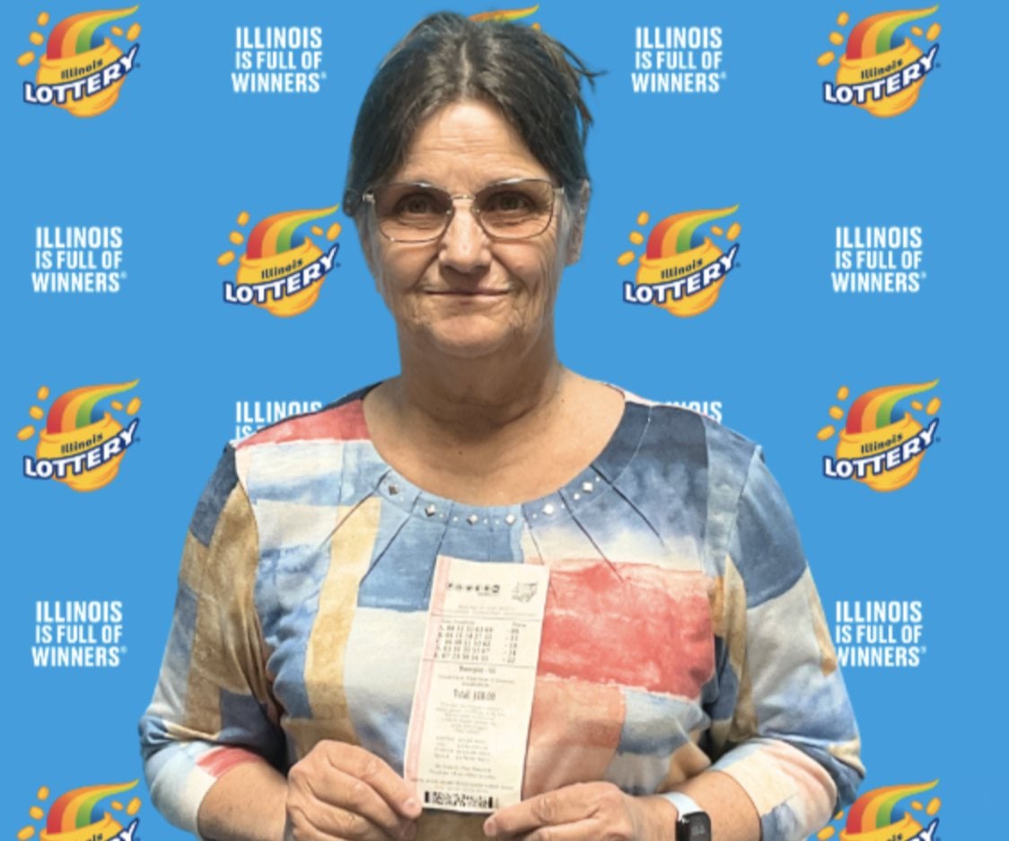 Diana of Carman, Illinois, takes a celebratory photo after claiming a $1 million Powerball prize.