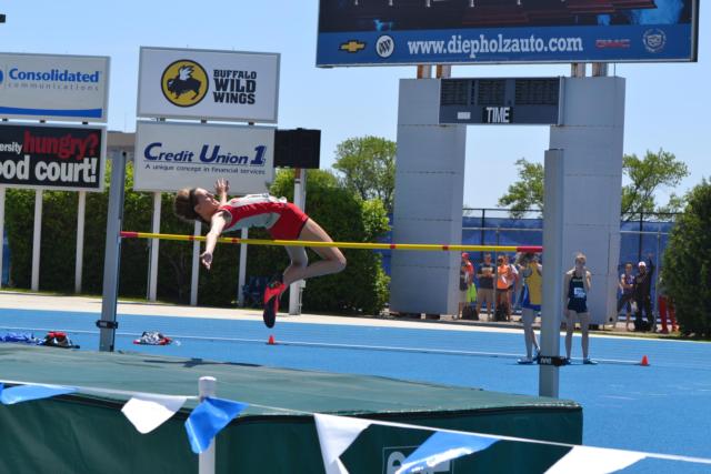 High jumper Katie Mans clears the bar to qualify for Saturday's finals at the state meet. (Photo by Dan Brannan)