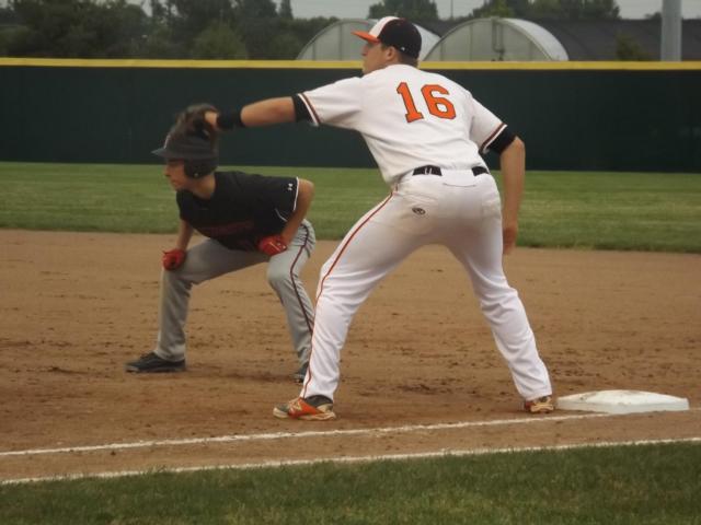 Edwardsville's Bailey Zimmer (16) holds at first against Triad's John McGee during the Tigers' 6-4 Senior Night win at Tom Pile Field Friday night.