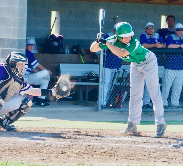 Garrett Settles dodges away from an inside pitch caught by Valmeyer catcher Tyler Kempfer.