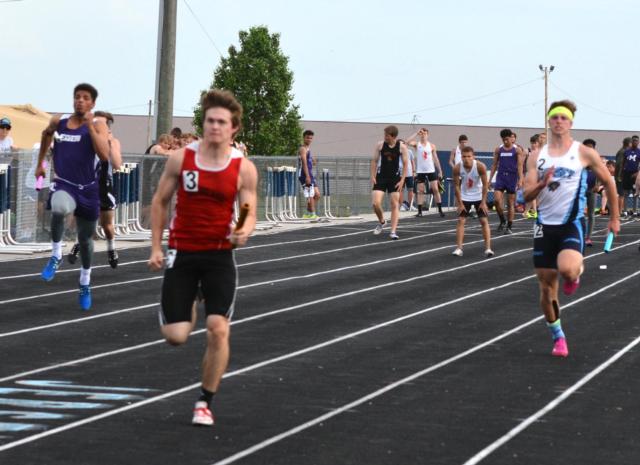 The Panthers' Lucas Ross drives to the finish line in the 4 x 100 relay anchor leg. (Photos by Dan Brannan)