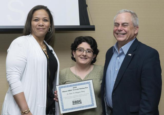 Photo (L-R): Illinois SBDC Network Assistant State Director Ericka Perkins, Jo Ann DiMaggio May, director of the Illinois SBDC for the Metro East at SIUE, and Illinois SBDC Network State Director Mark Petrilli.