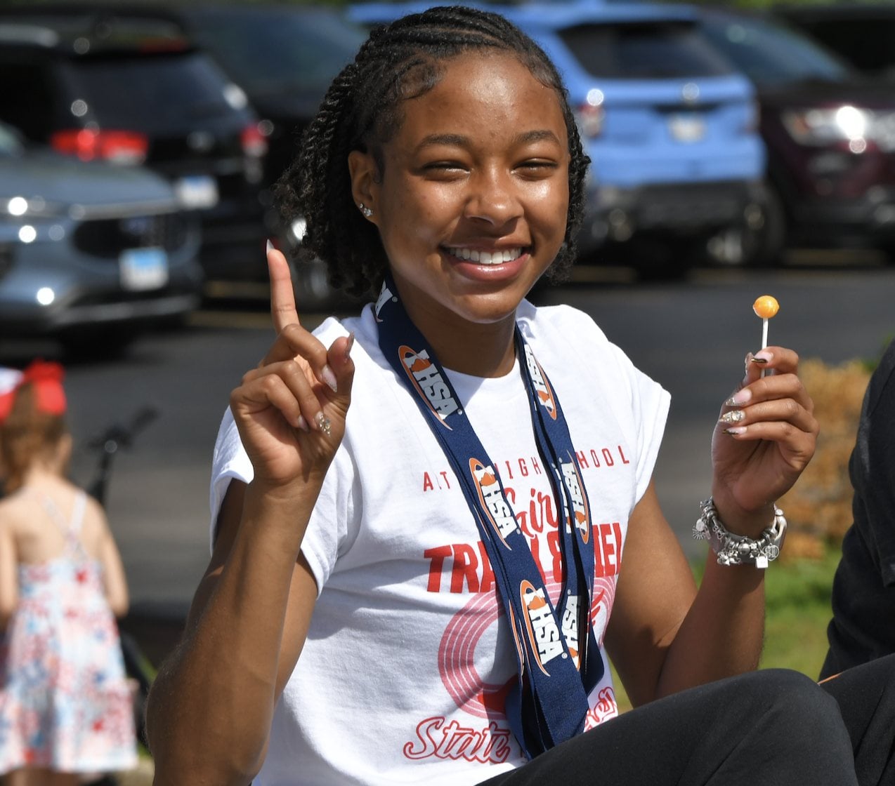 Alton state champion Rayna Raglin at the Alton Memorial Day Parade on Monday, May 25, 2026 with her state medals around her neck. (Photo by Dan Brannan).
