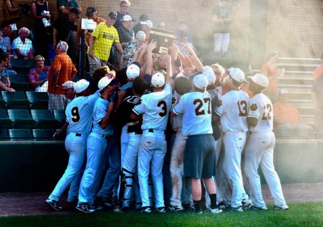 O'Fallon hoists the regional championship plaque.
