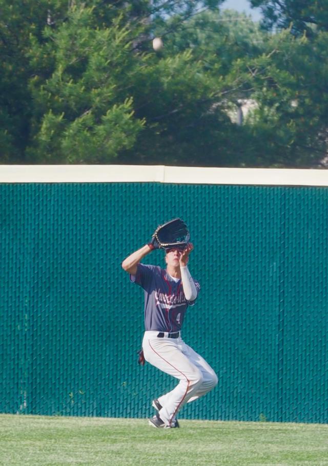Joe Copeland tracks down a deep fly ball in center field.