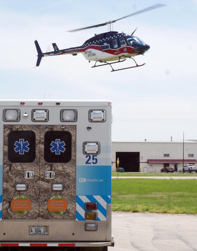  An Air Evac Lifeteam copter comes in for a landing over an AMH ambulance during the EMS Week picnic May 21 in Bethalto.