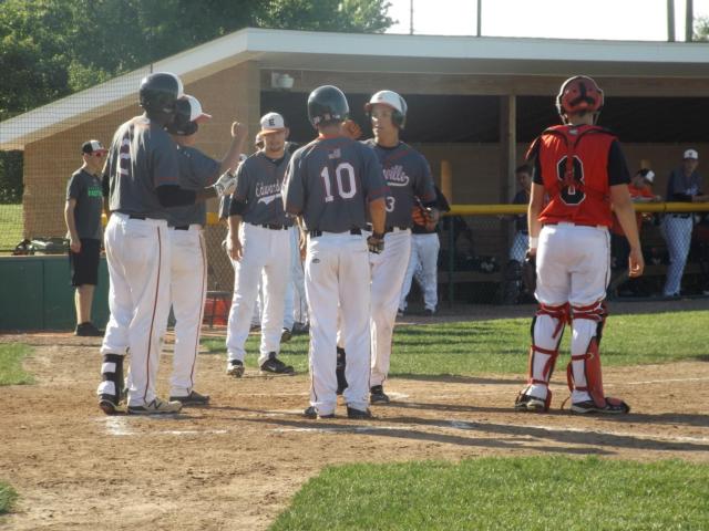 Jordan Hovey is congratulated after a key crack of the bat on Wednesday in the Edwardsville Regional. (Photo by Brent Feeney)