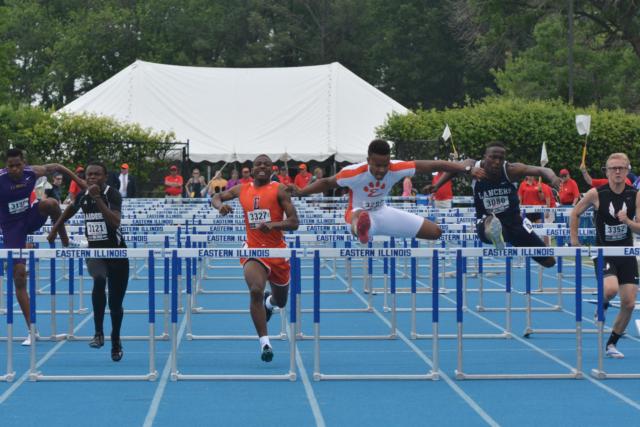 Edwardsville's Travis Anderson strides over his final hurdle in the 110-meter event at the IHSA State Track and Field Meet on Saturday. Next to him is his rival, Belleville East's William Session. (Photo by Dan Brannan)