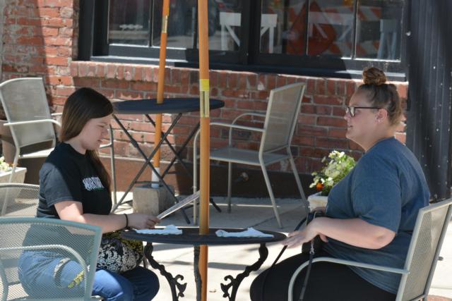 Emily Sirianni and Mandy Fox were the first customers in Downtown Alton for outside dining when the area opened Friday afternoon. (Photos by Dan Brannan)