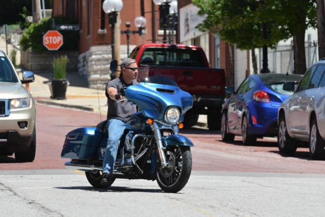 A motorcyclist is headed to one of the Downtown Alton establishments.