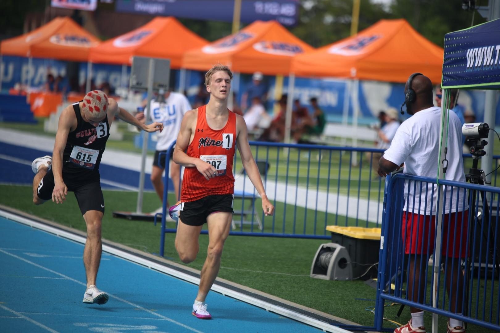Chaz Oberkfell captures the 1,600-meter race in a close finish. (Photo by Chris Rhodes).