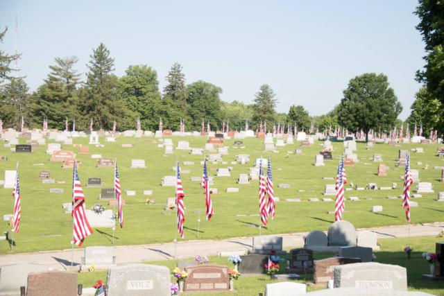 The beautiful Ave of Flags-Salute to Veterans display stands in honor & tribute on Memorial Day morning at Sunset Hill Funeral Home & Cemetery.