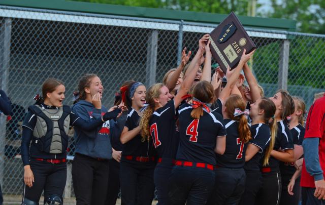 The Calhoun Warriors' softball girls celebrate after winning the sectional tourney at Brown County on Tuesday. (Photos by Doug Pool)