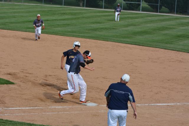 Bailey Zimmer tags a runner out at first base on Wednesday. (Photo by Dan Brannan)