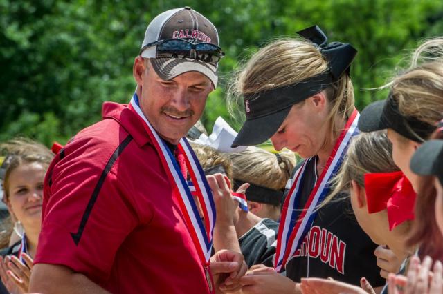 Calhoun girls softball head coach reflects with his daughter, Grace Baalman, the pitching star, after winning a second straight state title. (Photo courtesy of Michael R. Weaver)