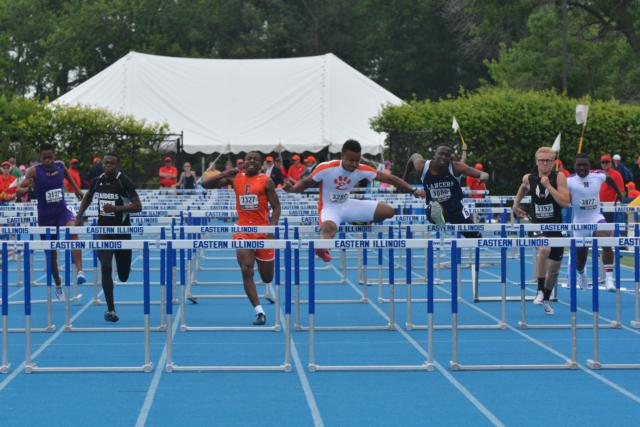 Champion hurdler Travis Anderson goes head to head with Belleville East's William Session in a 110-hurdle race at the state meet. (Photo by Dan Brannan)