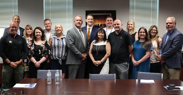 LEFT TO RIGHT: Madison County Sheriff’s Capt. Kris Tharp; Chief Deputy Marcos Pulido; Meredith Parker and Elizabeth Bhandari of Alton Memorial Hospital’s Center for Behavioral and Addiction Medicine; Alton Memorial Hospital Vice President and COO Brad Goacher; Michelle Brooks, Office Manager/Resource Specialist for Madison County Mental Health Board; Sheriff Jeff Connor; State’s Attorney Tom Haine; Madison County Mental Health Board Executive Director Deborah Humphrey; Ty Bechel, Executive Director of AMARE; Brent Cummins, Clinical Director of Integrated Behavioral Health for Chestnut Health Systems; Denise Bradley, Program Manager for Madison County Mental Health Board; Taylor Marks, Grant Manager for Centerstone of Illinois; Melissa Hassen, Regional Recovery & Community Care Coordinator for Amare; and Dr. Jeremy Jewell of Jewell Psychological Services.