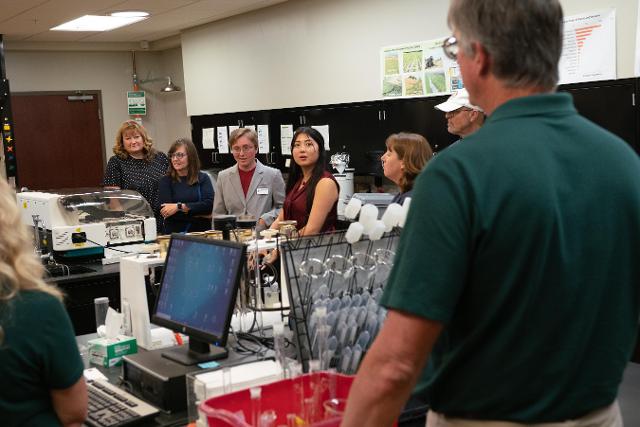 John Sloan (front right) discussed his research with Illinois state legislators at the event.