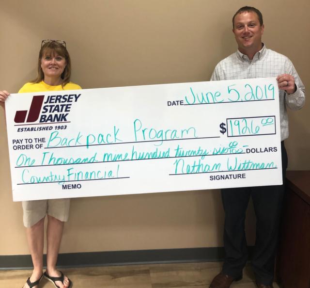 From left to right: Shelley Pointer from the Backpack Program and Nathan Wittman