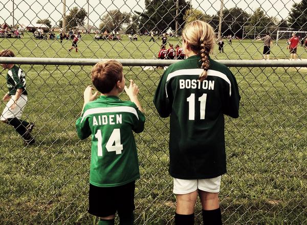 Aiden Talley, and his big sister, Boston Talley, watch some of the competition at Dolan Park during the 2012 season.