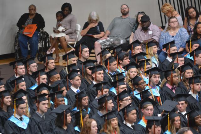 Basketball star Caleb Strohmeier is in the center of this group photo.