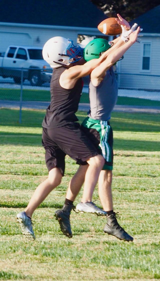 A Carrollton and Jerseyville player go up for a jump ball.
