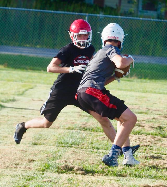 A Panther receiver is tracked down by a Calhoun defender.